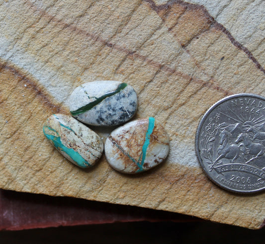 A trio of mixed color boulder-cut Stone Mountain Turquoise cabochons