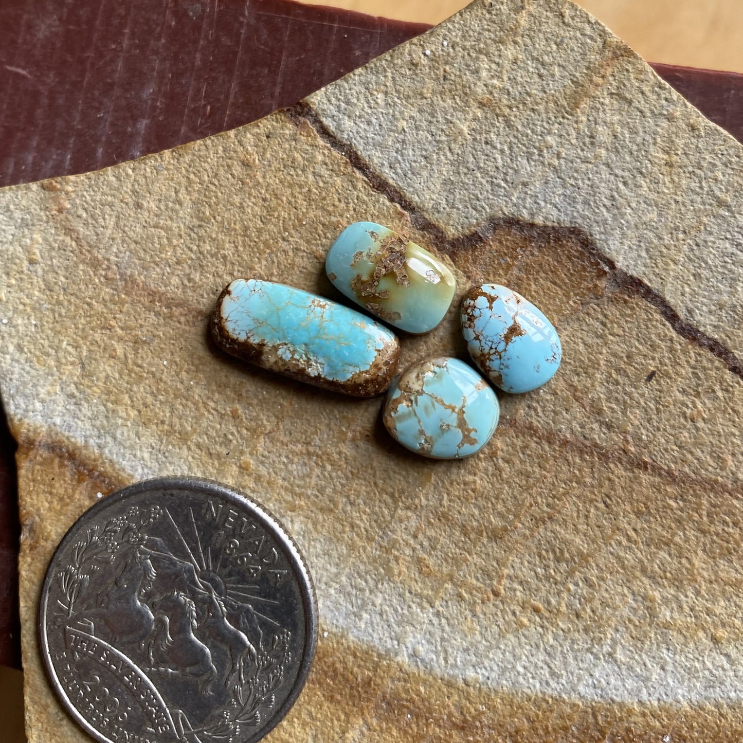 9 carats blue Stone Mountain Turquoise cabochons with red matrix