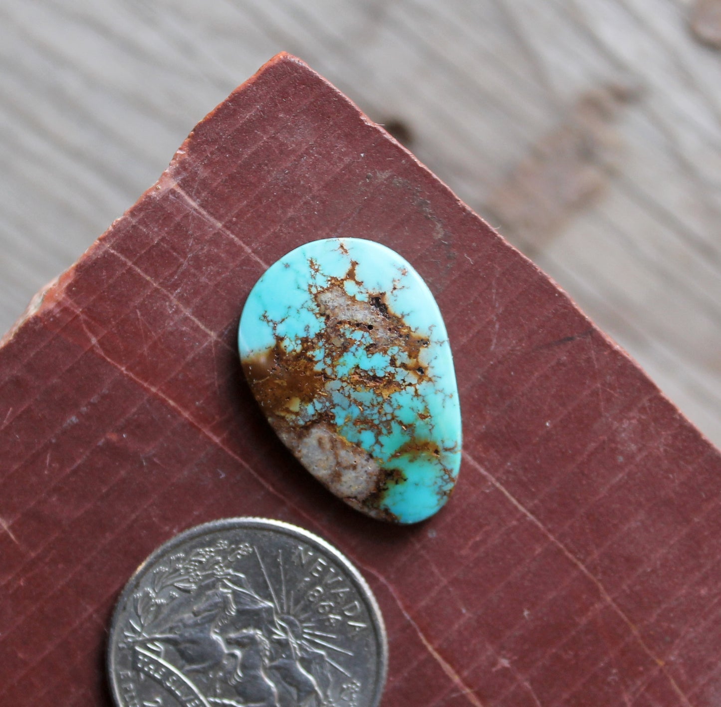 14 carat blue Stone Mountain Turquoise cabochon with red matrix