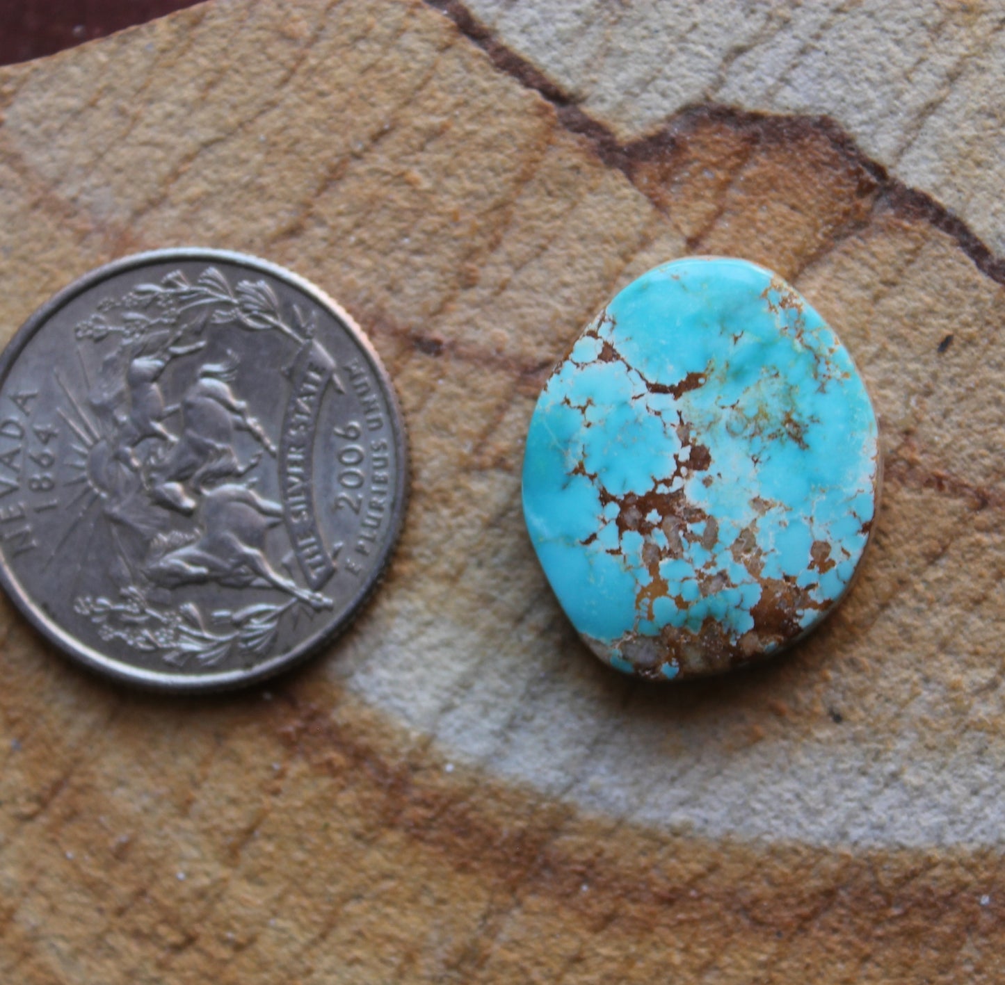 18 carat blue Stone Mountain Turquoise cabochon with red matrix