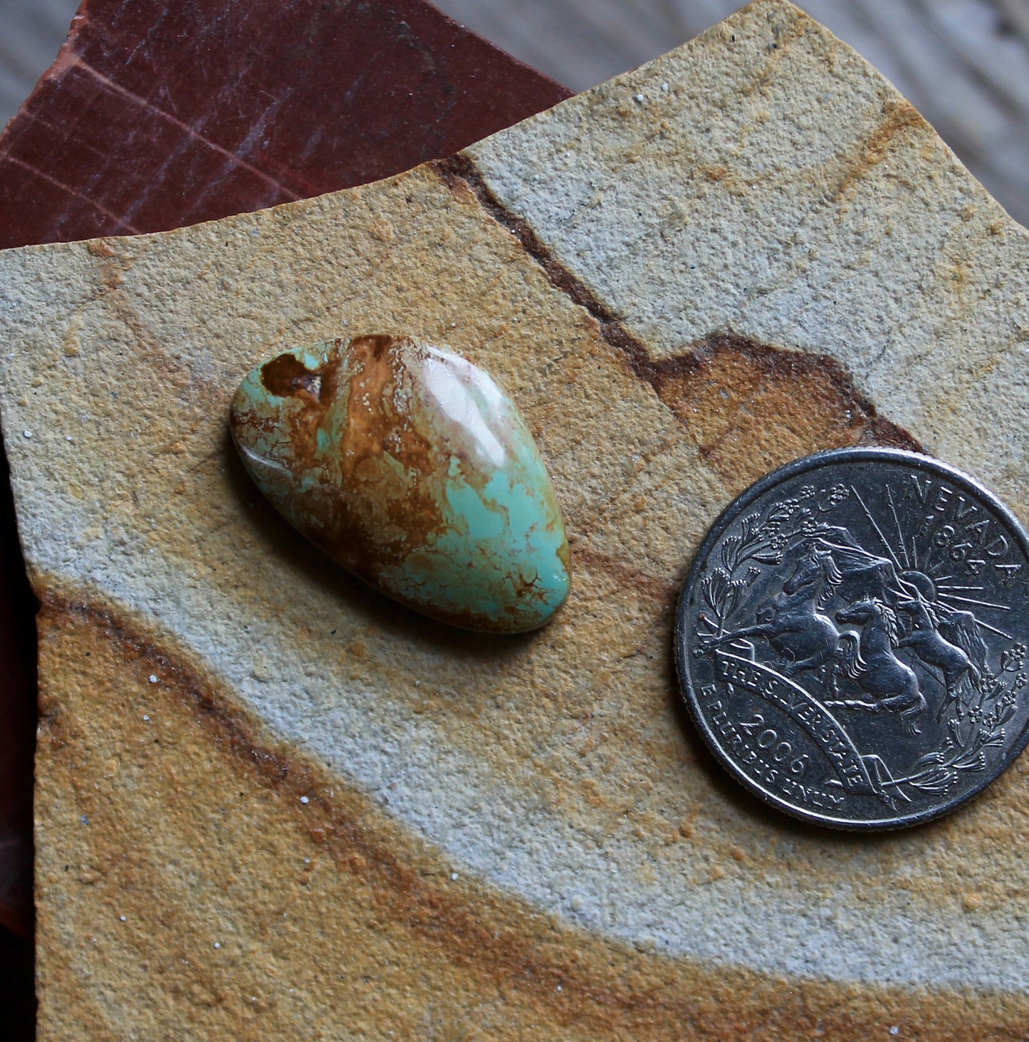 12 carat blue Stone Mountain Turquoise cabochon with red inclusions