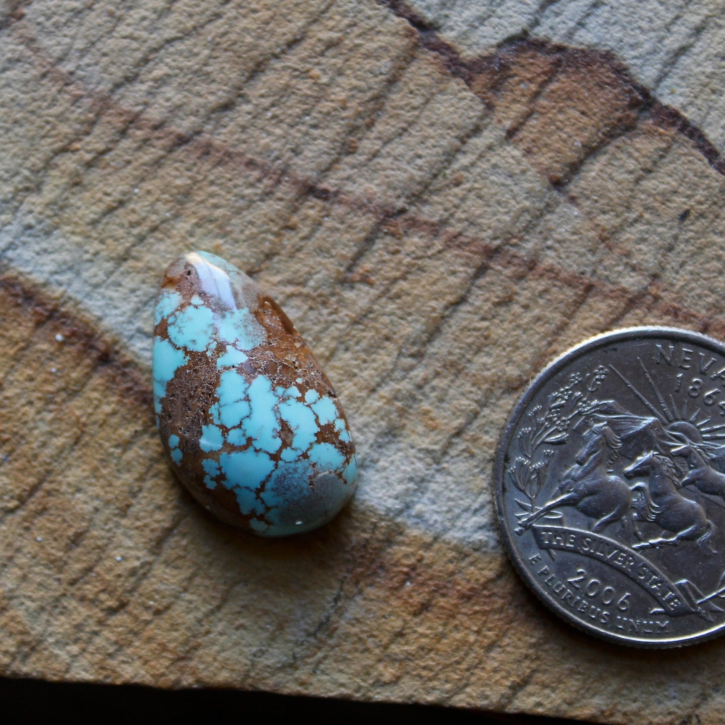 13 carat blue Stone Mountain Turquoise cabochon with red webbing