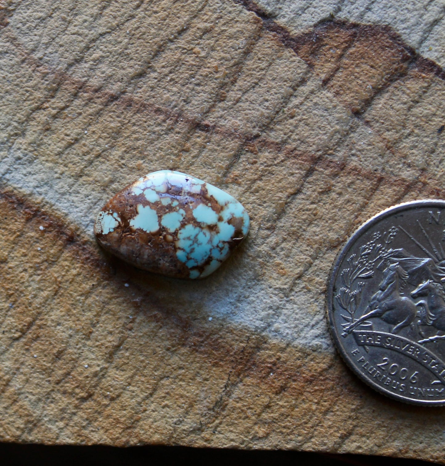 7 carat blue Stone Mountain Turquoise cabochon with red webbing