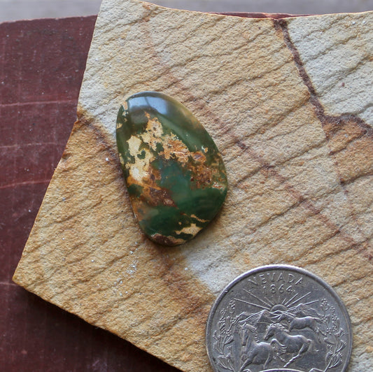 11 carat dark green Stone Mountain Turquoise cabochon with red matrix