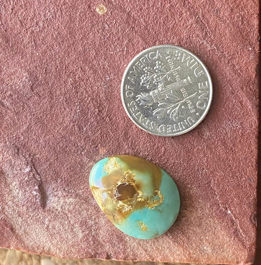 9 carat blue Stone Mountain Turquoise cabochon with red inclusions and a high dome