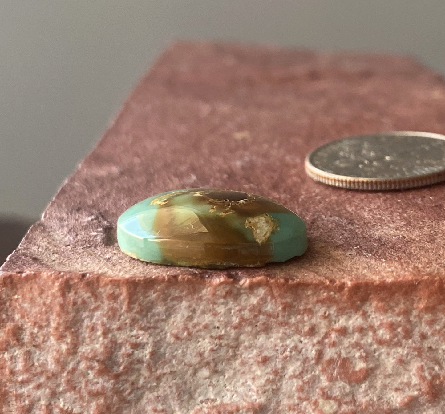 9 carat blue Stone Mountain Turquoise cabochon with red inclusions and a high dome