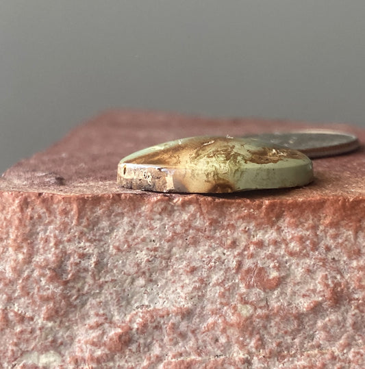 13 carat green Stone Mountain Turquoise cabochon with red inclusions