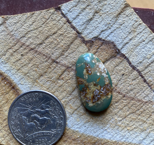 14 carat green Stone Mountain Turquoise cabochon with red matrix 14 carat green Stone Mountain Turquoise cabochon with red matrix