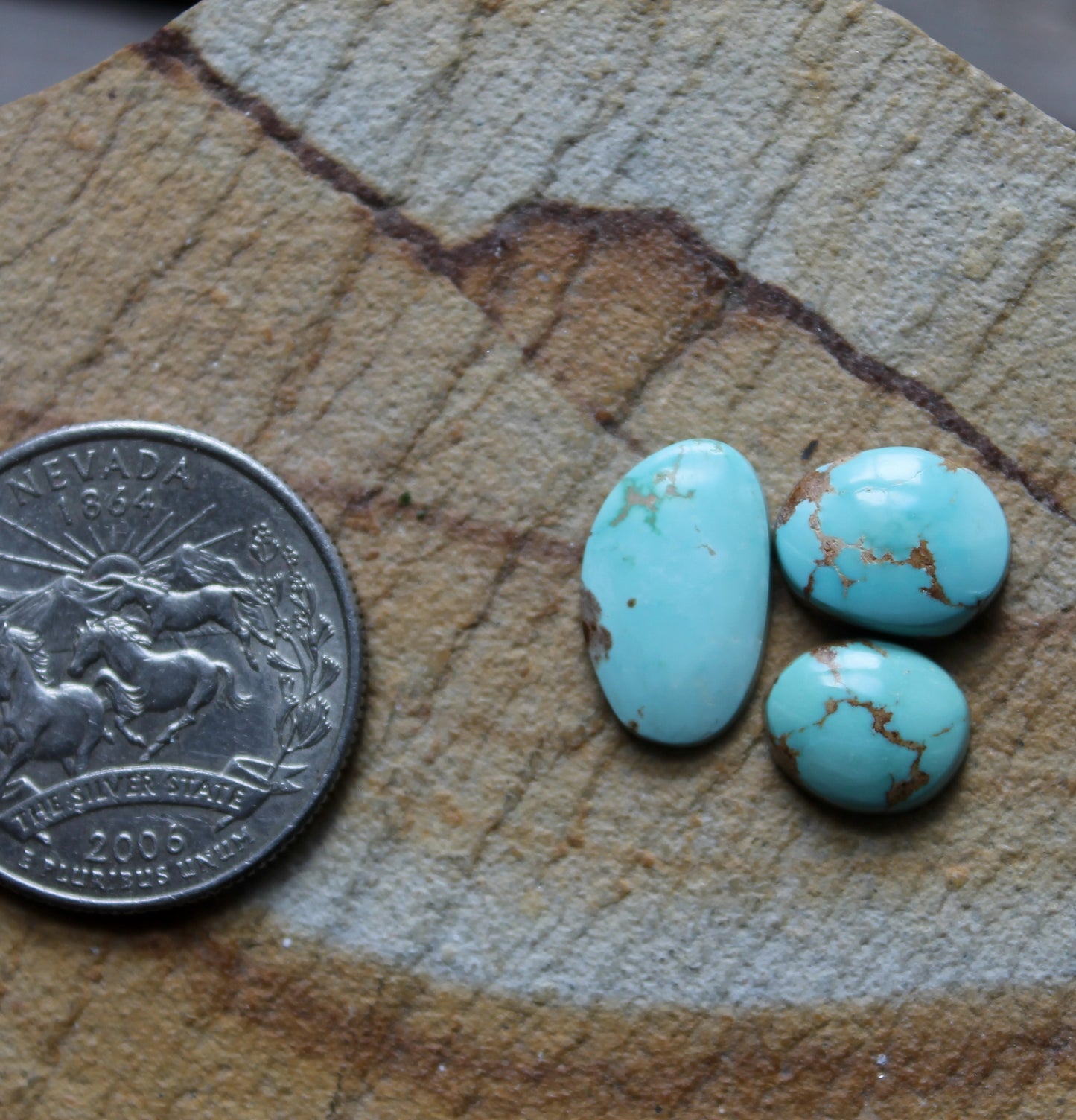 A trio of light blue Stone Mountain Turquoise cabochons