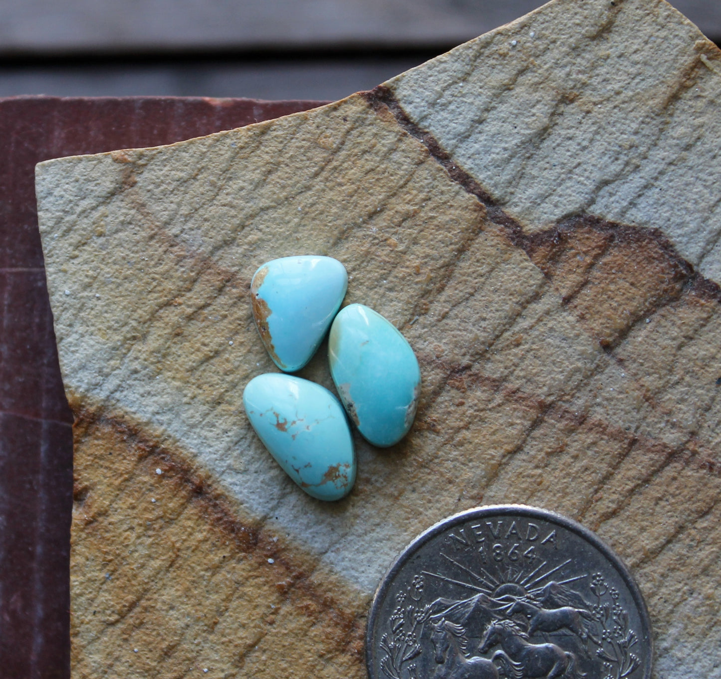 A trio of light blue Stone Mountain Turquoise cabochons