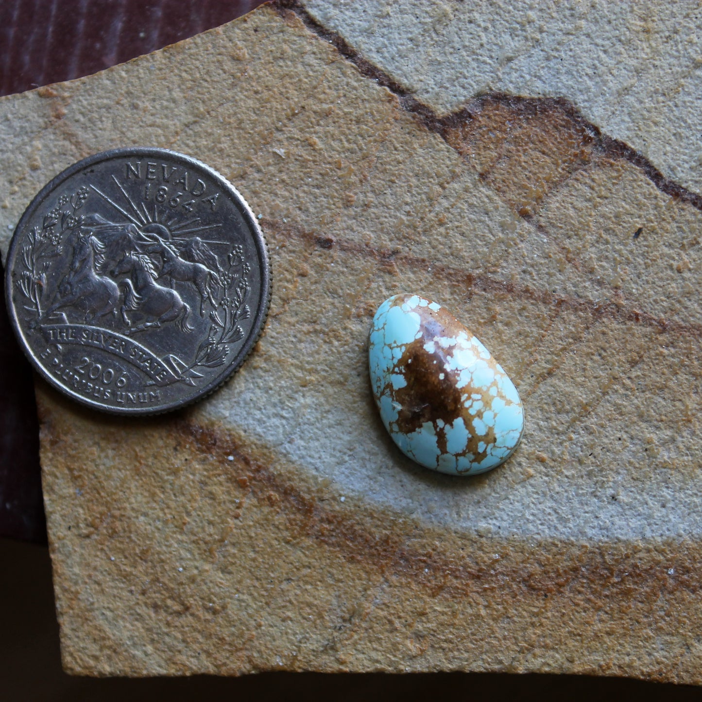 5 carat light blue Stone Mountain Turquoise cabochon with red matrix