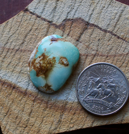 18 carat light green Stone Mountain Turquoise cabochon with red matrix