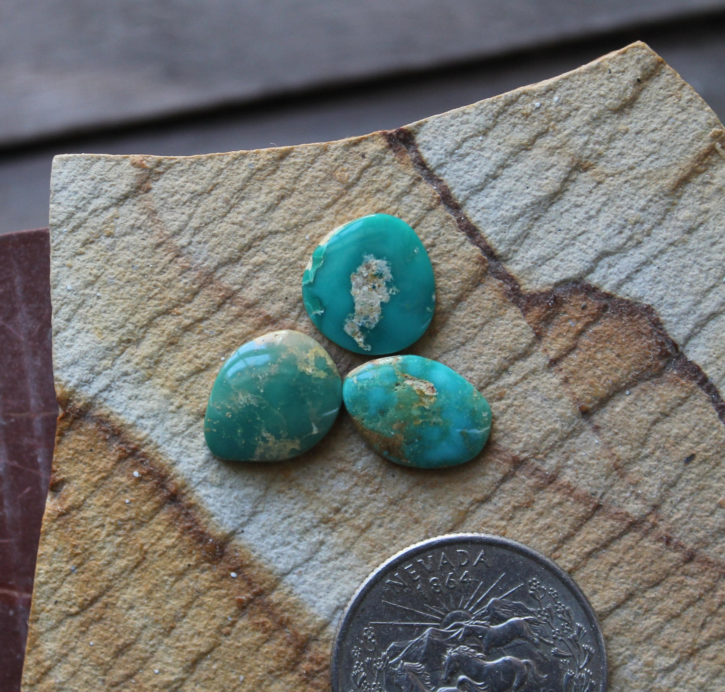 A trio of green Stone Mountain Turquoise cabochons