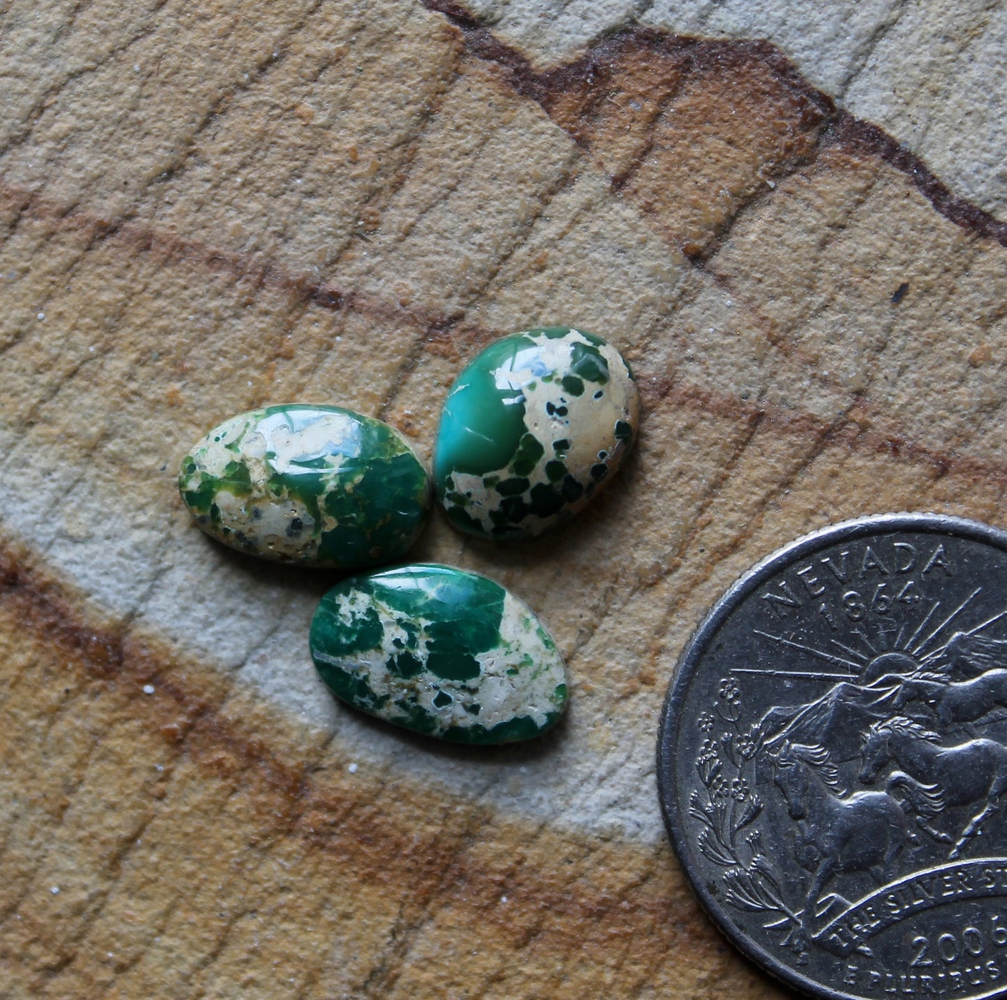 A trio of green Stone Mountain Turquoise cabochons