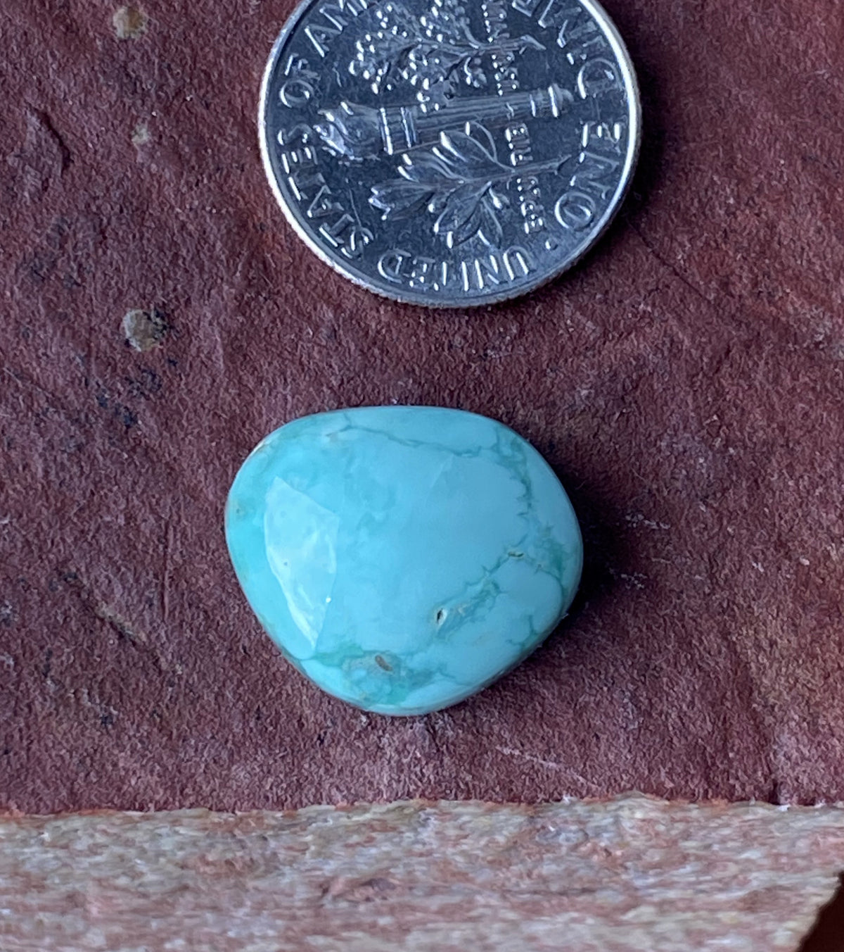 10 carat light green natural Tonopah cabochon with a high dome