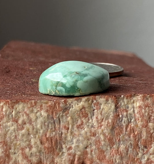 10 carat light green natural Tonopah cabochon with a high dome