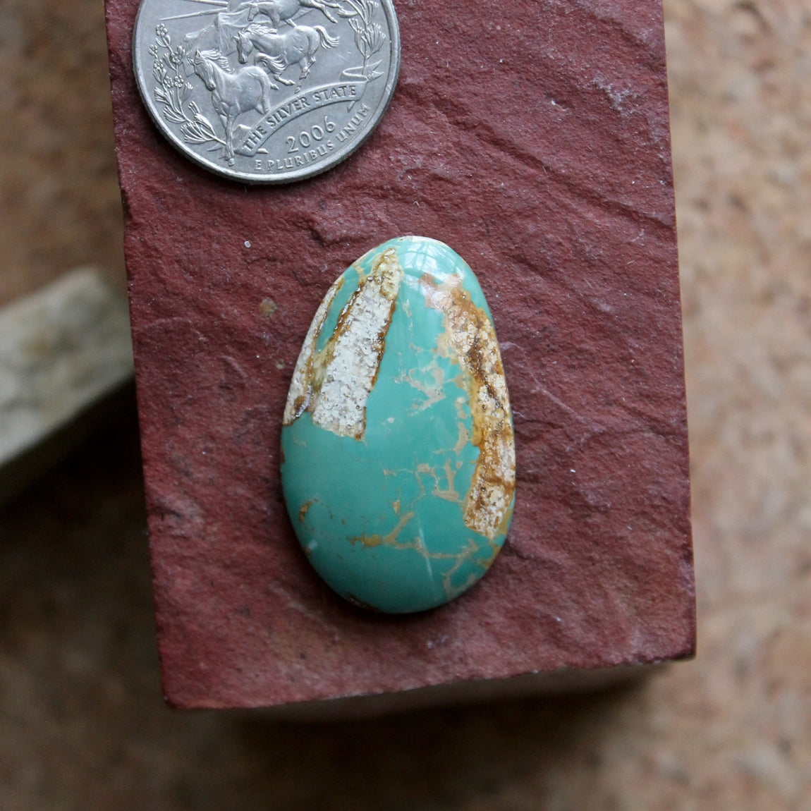 30 carat blue-teal Stone Mountain Turquoise cabochon with a high dome