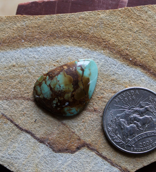 14 carat blue Stone Mountain Turquoise cabochon with red matrix 14 carat blue Stone Mountain Turquoise cabochon with red matrix