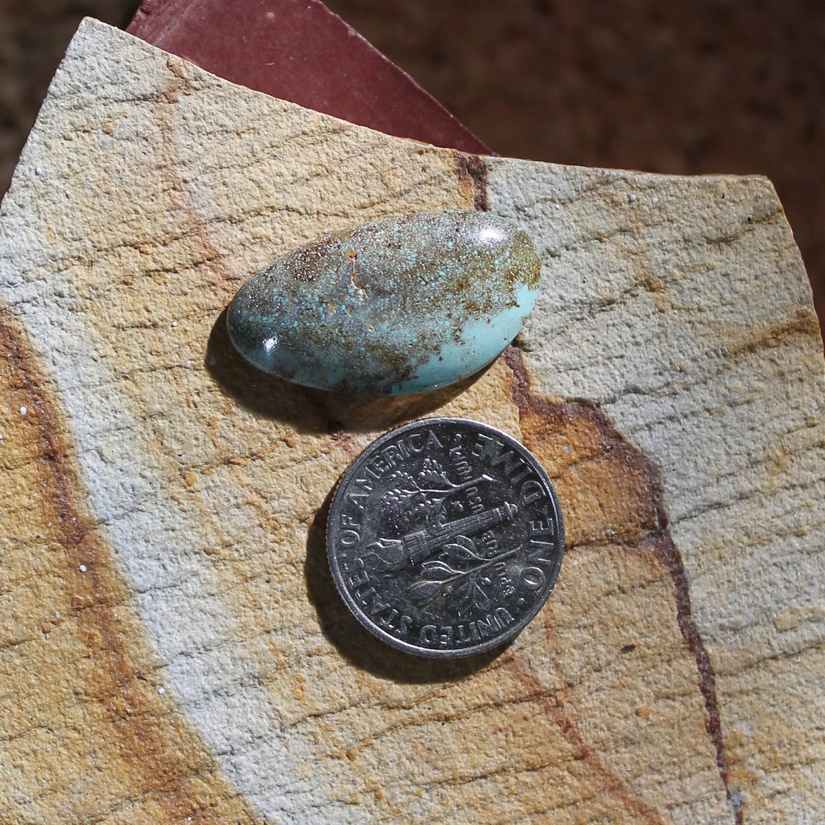 8.1 carat light blue Taubert Hills turquoise cabochon with red matrix