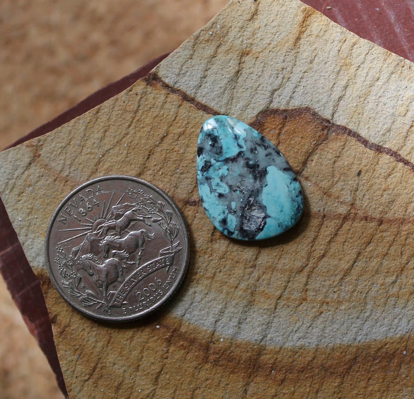 8.1 carat light blue natural Blue June turquoise cabochon with black matrix