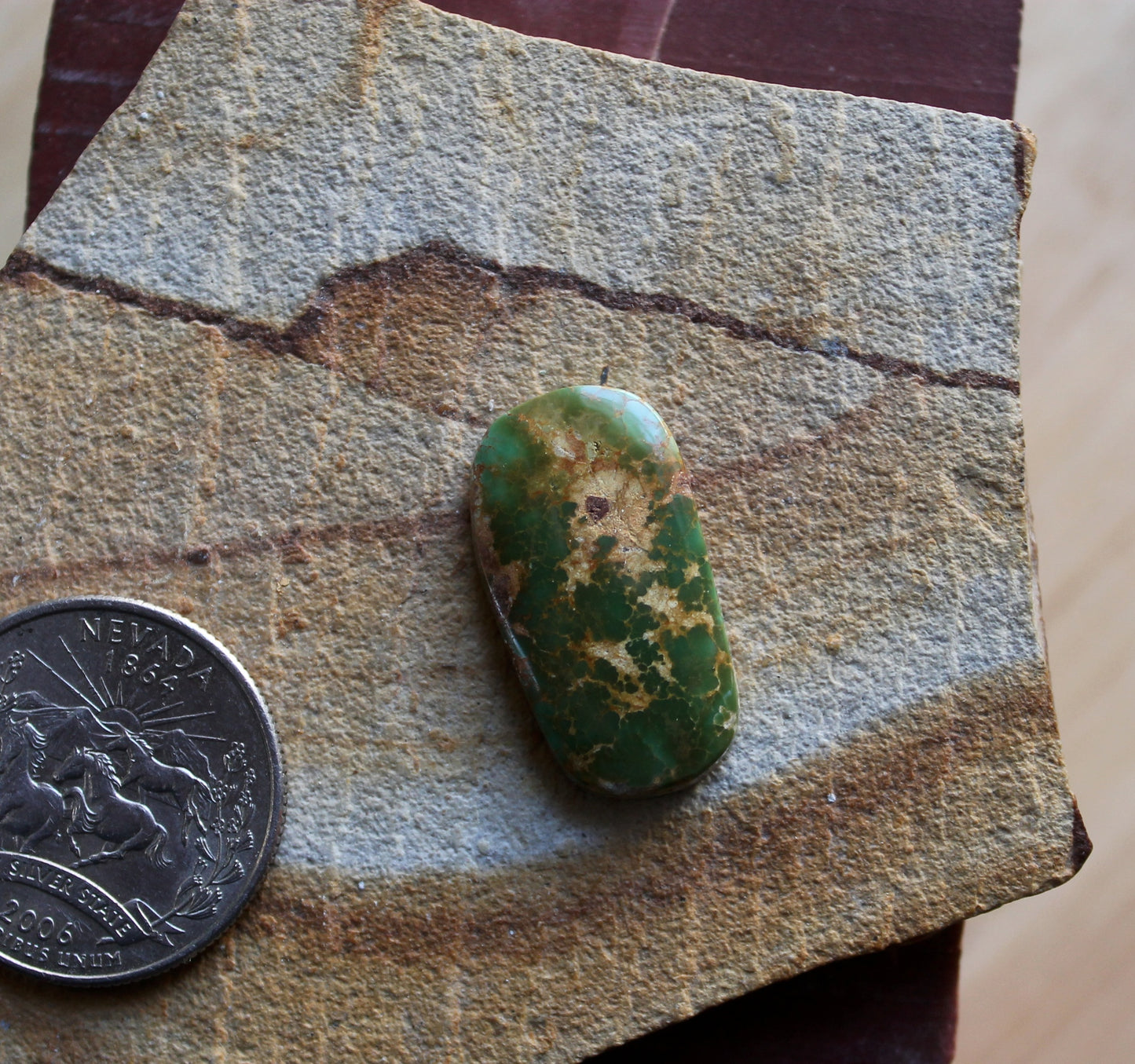 11 carat dark green Stone Mountain Turquoise cabochon with red matrix
