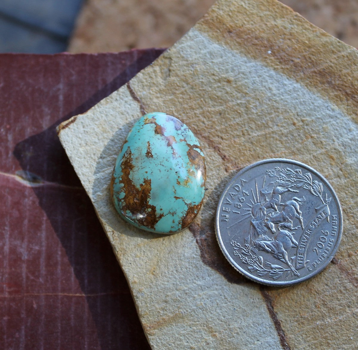 15.6 carat blue Stone Mountain Turquoise cabochon with red matrix