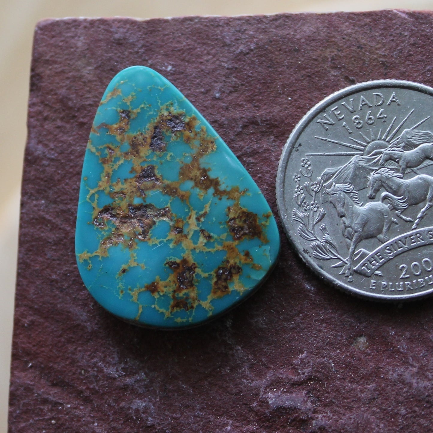 17 carat blue teal Stone Mountain Turquoise cabochon with red matrix