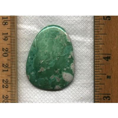 A large green variscite cabochon from southern Utah. This is an un-backed, untreated cabochon designed by the Nevada Cassidys.