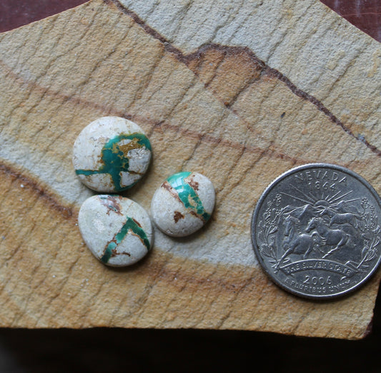 A trio of teal green boulder-cut Stone Mountain Turquoise cabochons