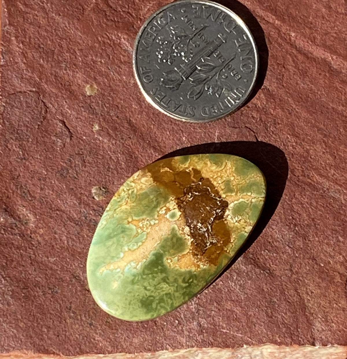19 carat natural green Stone Mountain Turquoise cabochon with red matrix