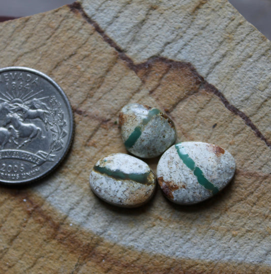A trio of boulder-cut Stone Mountain Turquoise cabochons