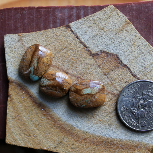 A trio of boulder-cut Stone Mountain Turquoise cabochons