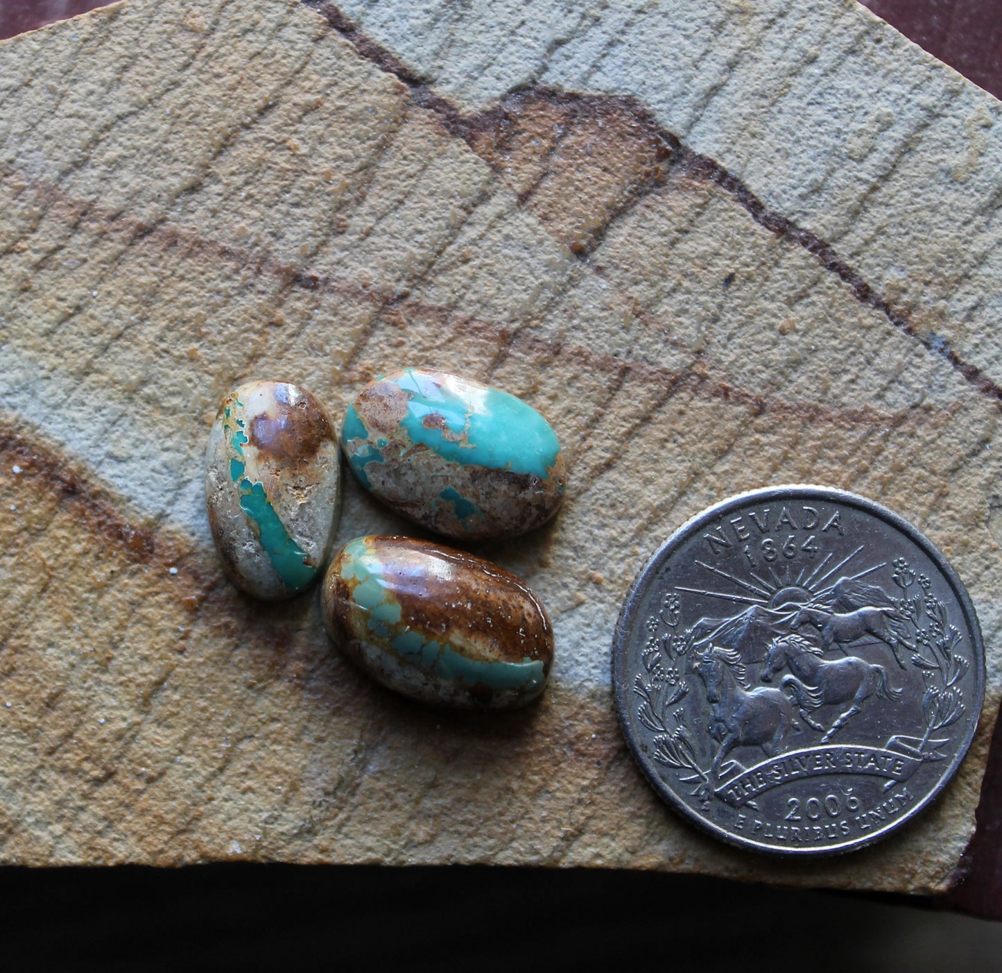 A trio of boulder-cut Stone Mountain Turquoise cabochons