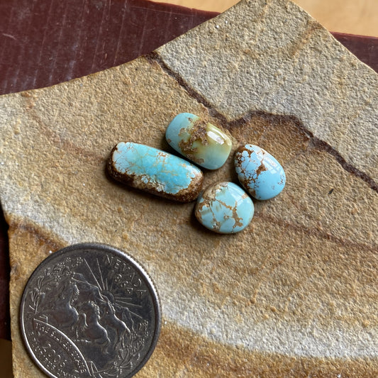 9 carats blue Stone Mountain Turquoise cabochons with red matrix