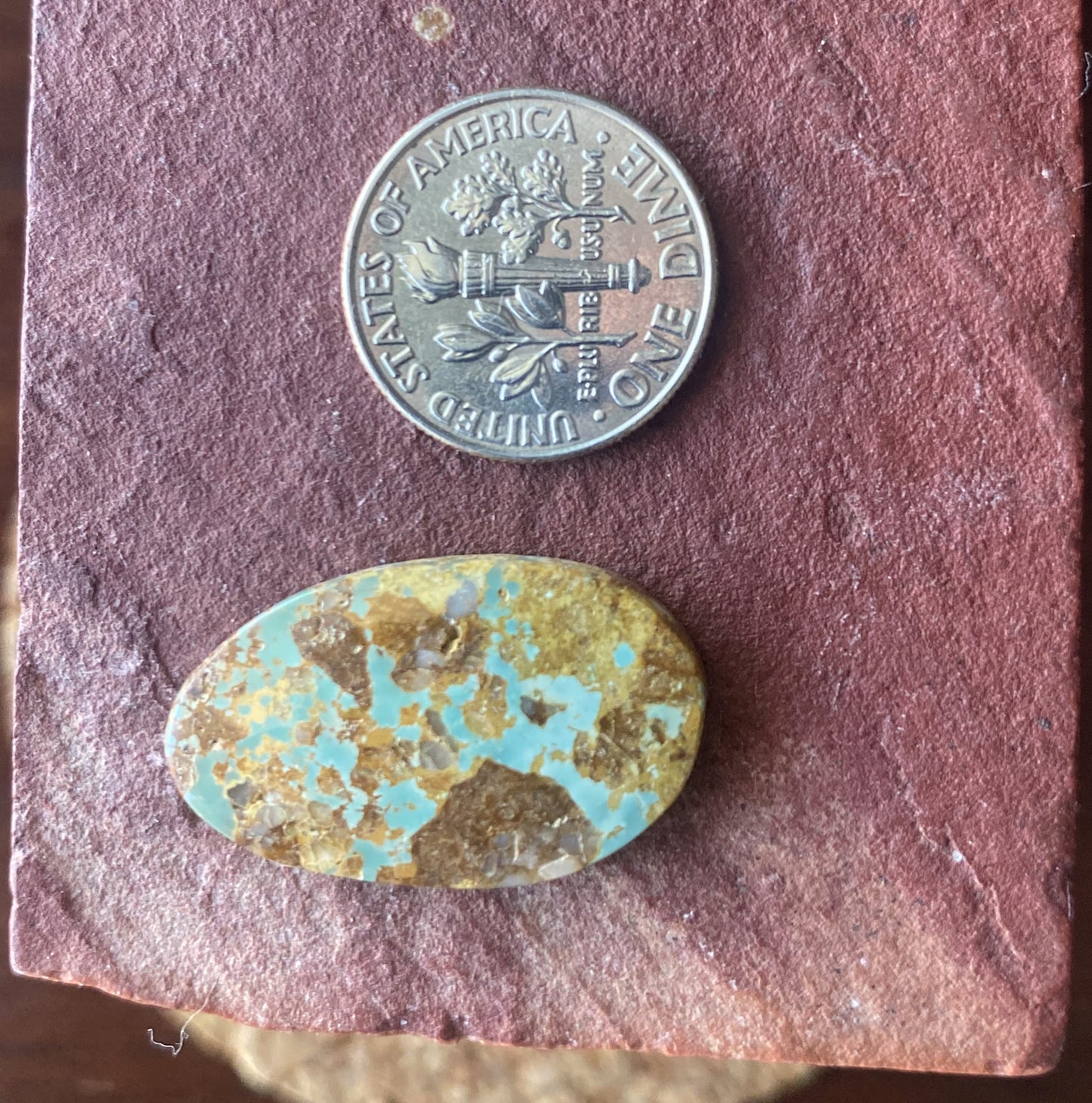 14 carat light blue Stone Mountain Turquoise cabochon with red matrix
