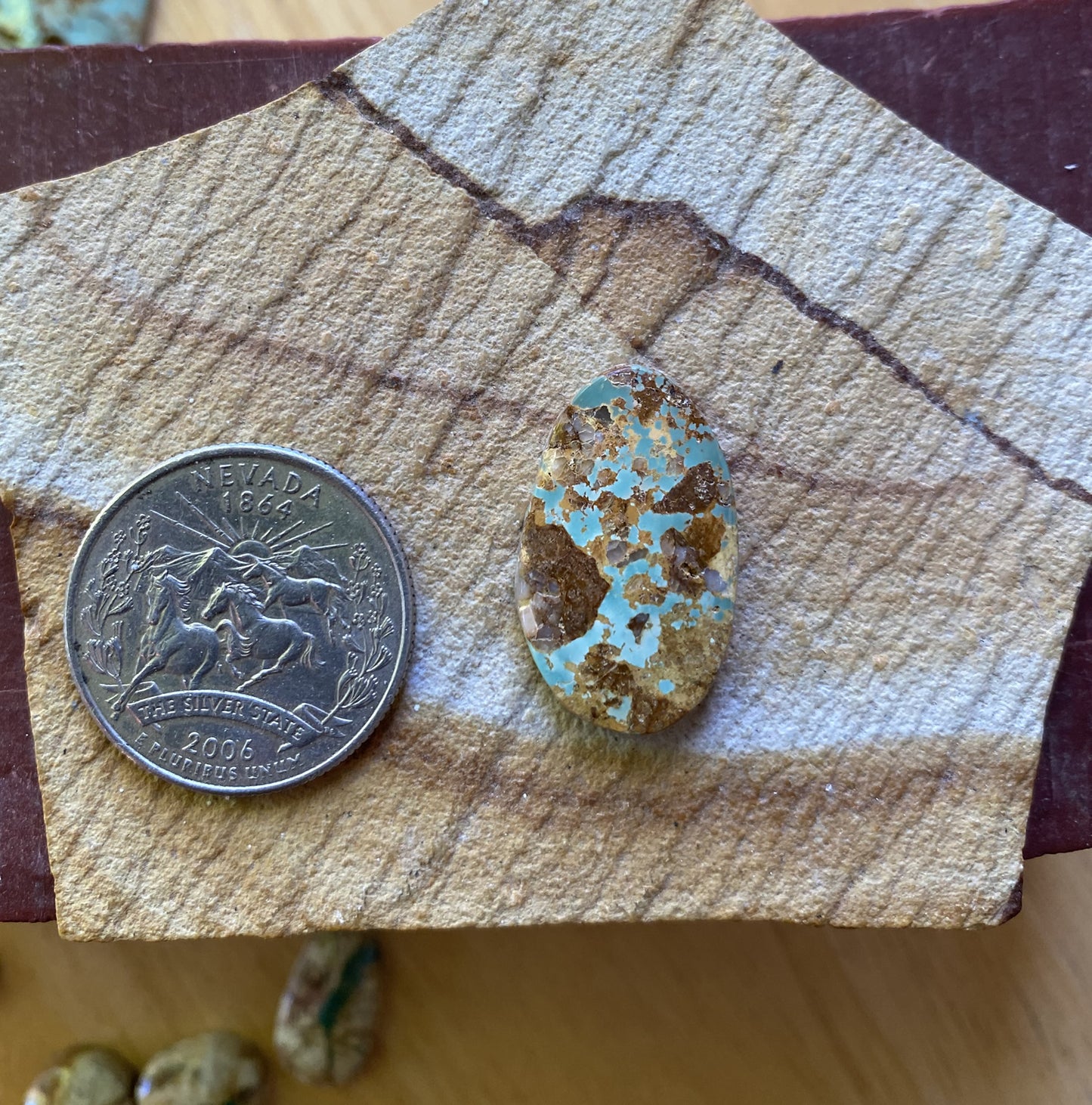 14 carat light blue Stone Mountain Turquoise cabochon with red matrix