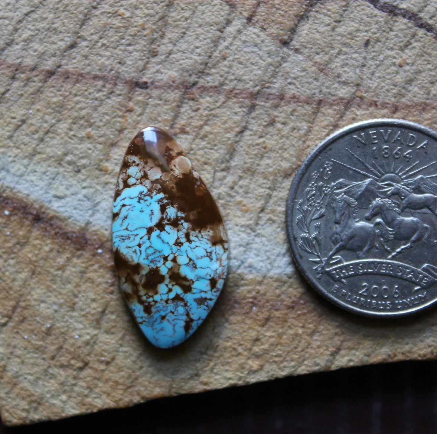 12 carat blue Stone Mountain Turquoise cabochon with red inclusions