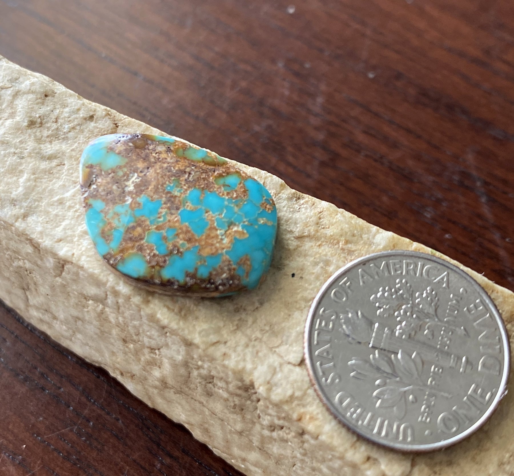 8 carat dark blue Stone Mountain Turquoise cabochon with red