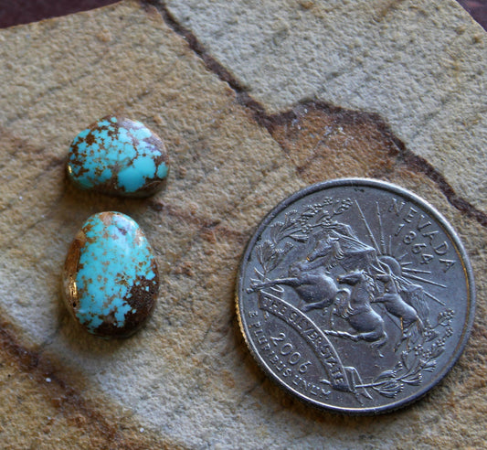 Two blue Stone Mountain Turquoise cabochons with red matrix