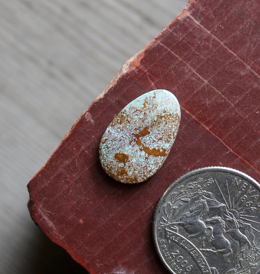 6 carat light blue Stone Mountain Turquoise cabochon with red inclusions