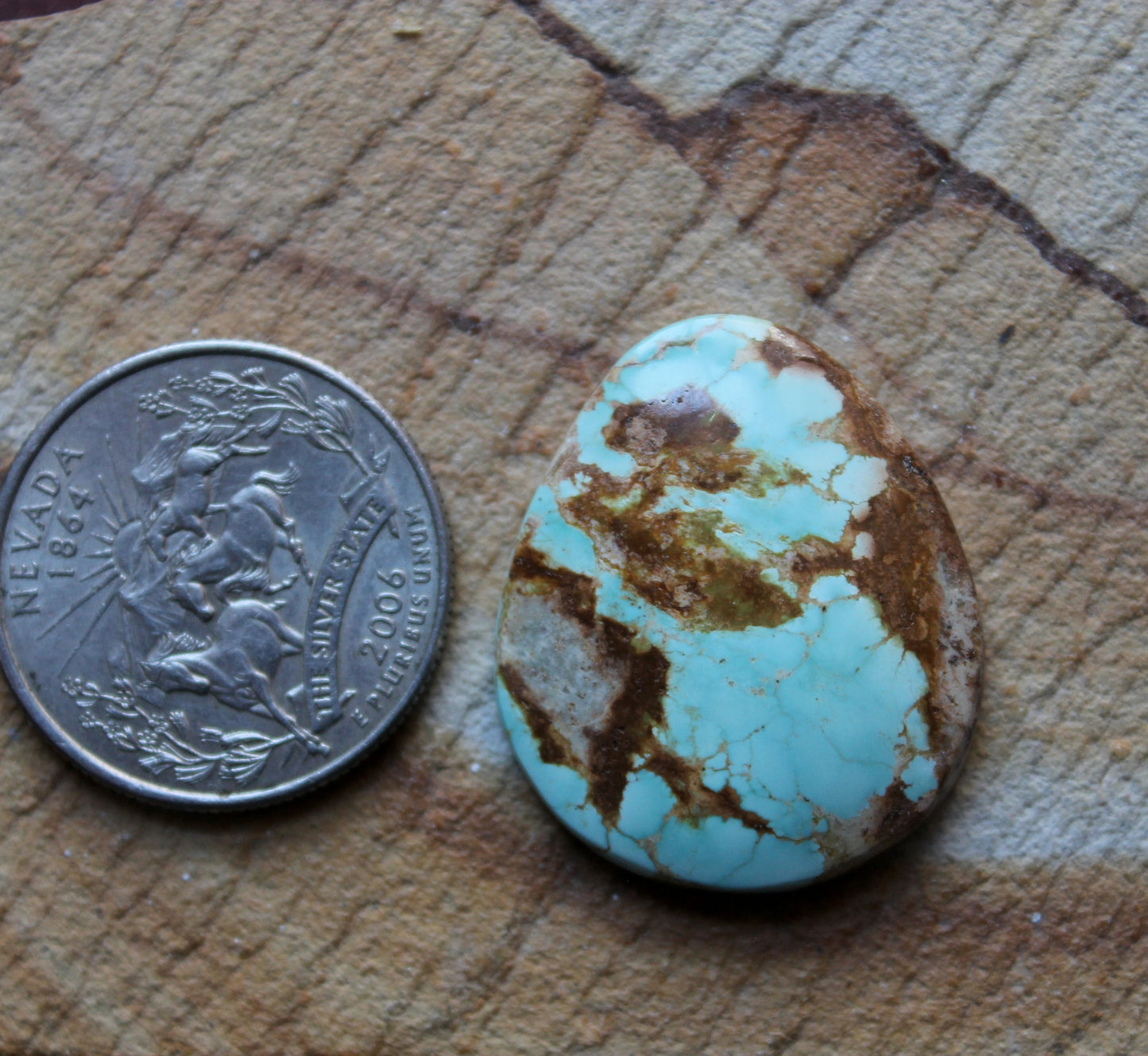 24 carat light blue Stone Mountain Turquoise cabochon with red matrix