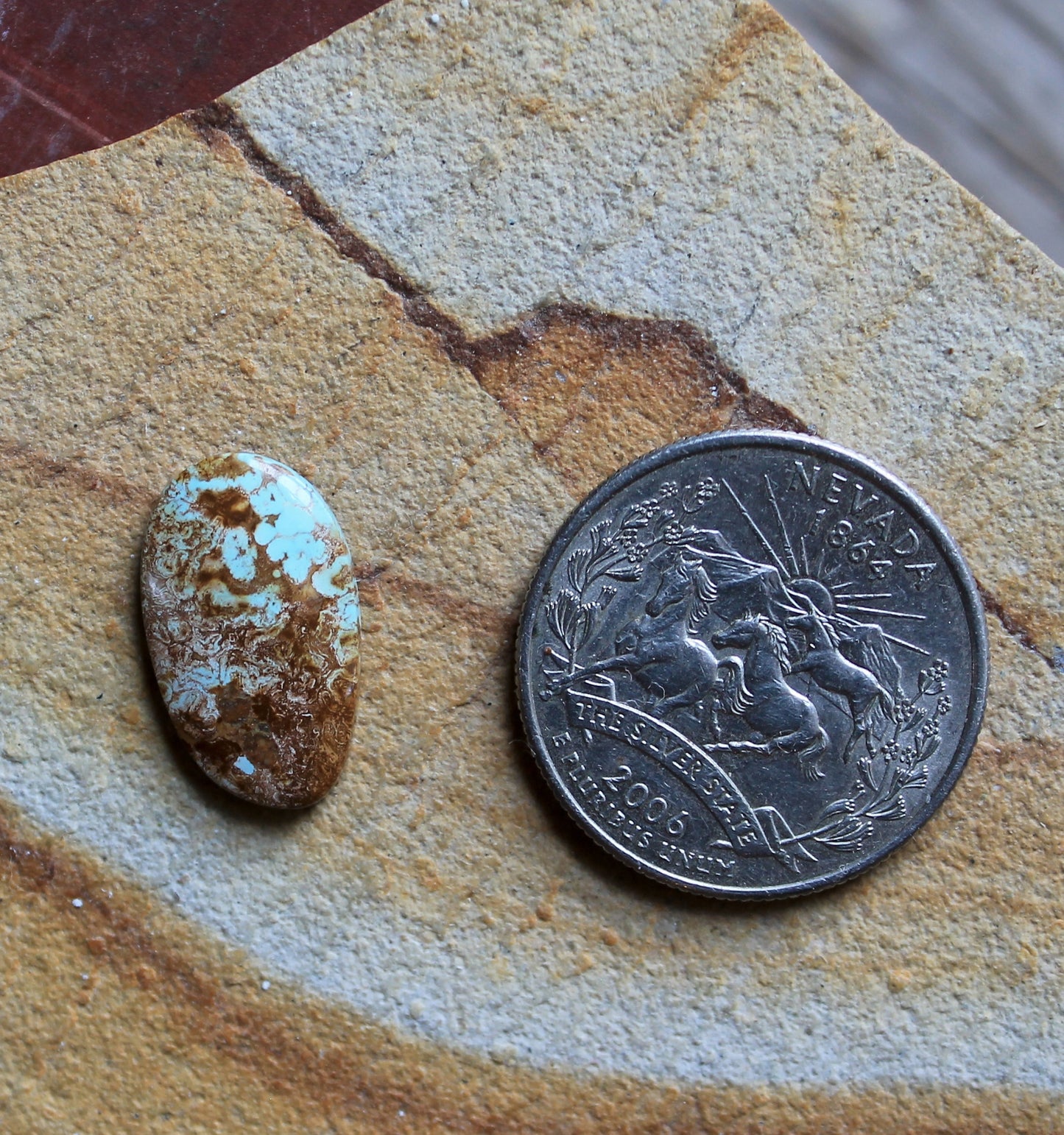 4 carat light blue Stone Mountain Turquoise cabochon with red inclusions