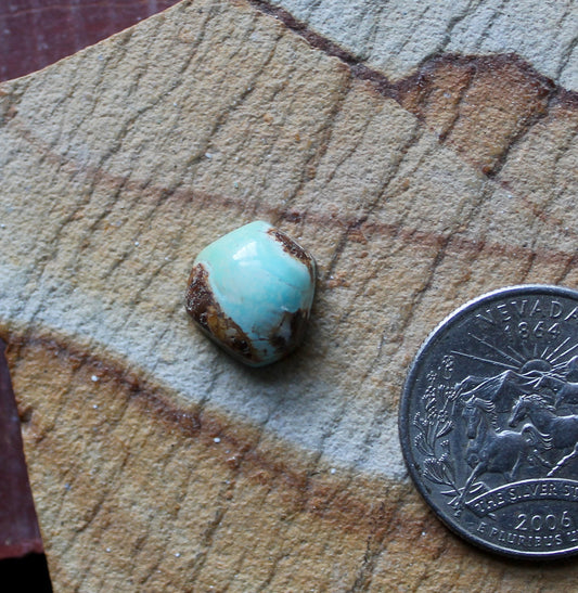 5 carat light blue Stone Mountain Turquoise cabochon with red matrix