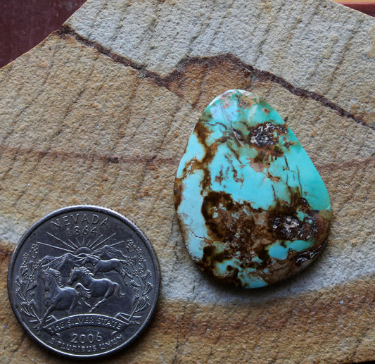 22 carat blue Stone Mountain Turquoise cabochon with red matrix