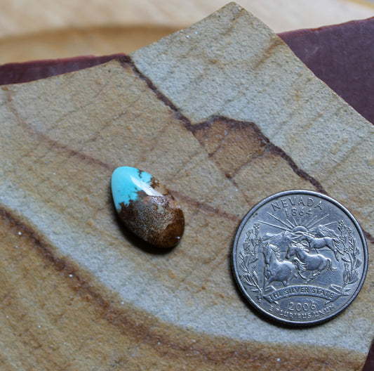 5 carat blue Stone Mountain Turquoise cabochon with red inclusions