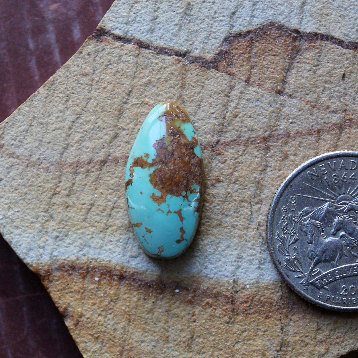 12 carat blue Stone Mountain Turquoise cabochon with red matrix