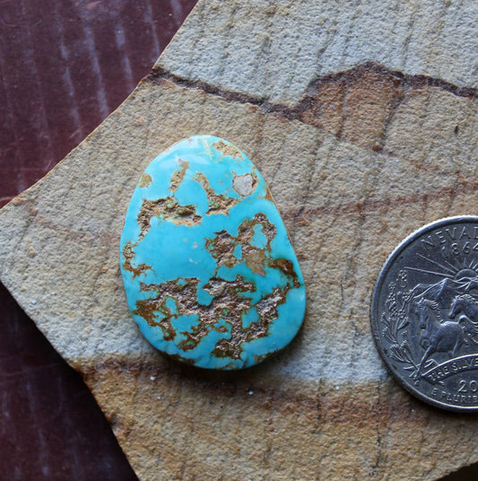 21 carat blue Stone Mountain Turquoise cabochon with red matrix