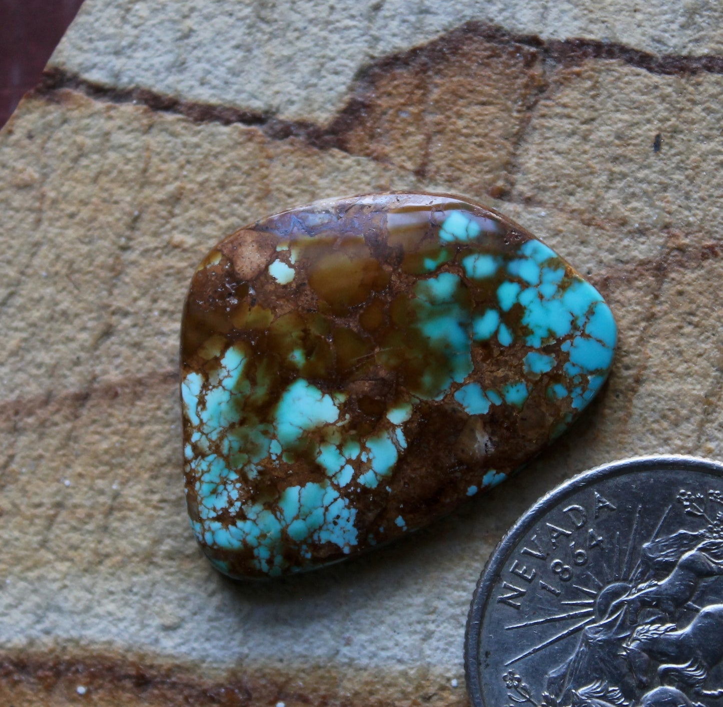 21.2 carat blue Stone Mountain Turquoise cabochon with red matrix
