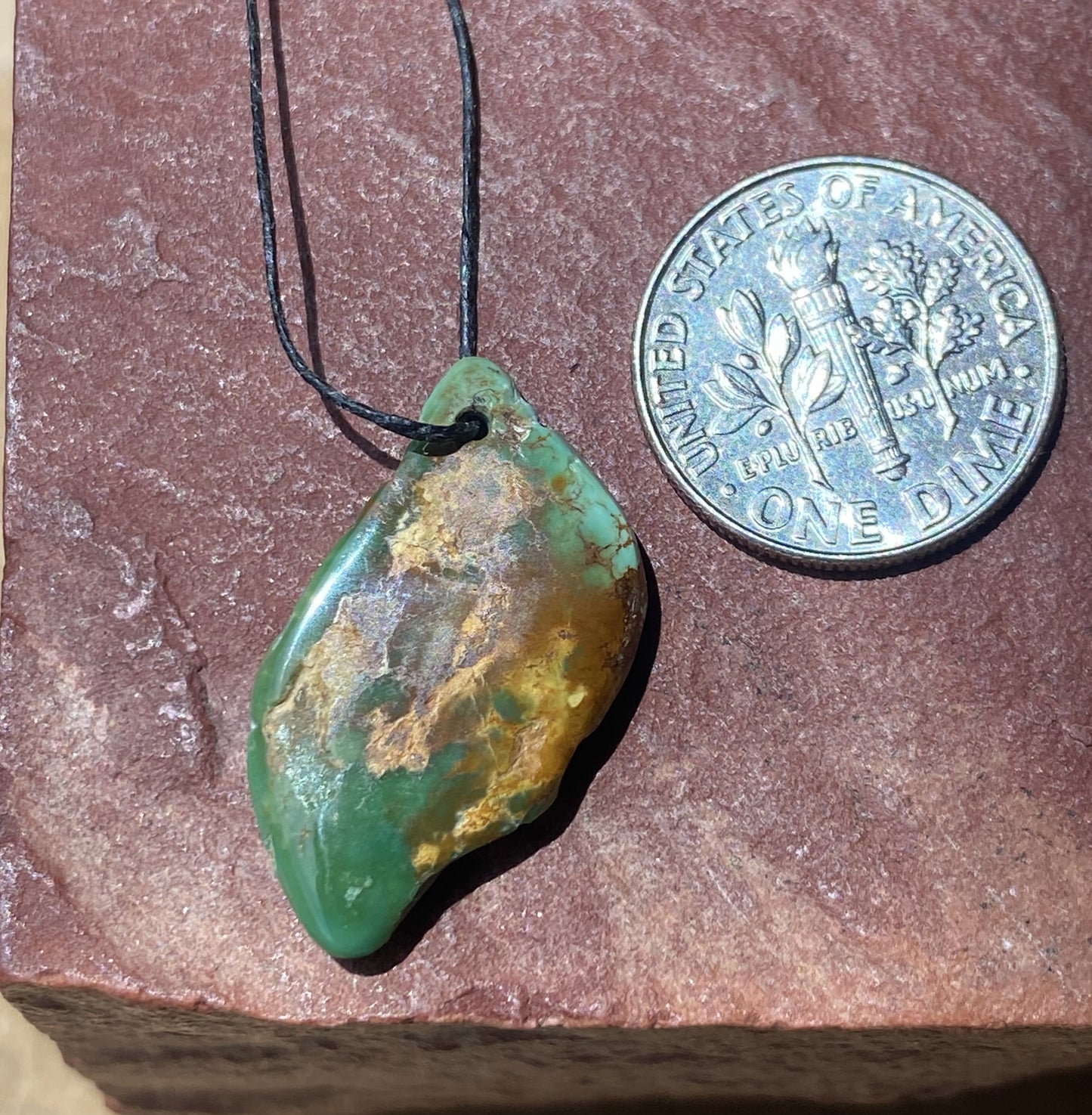 8 carat blue Stone Mountain Turquoise tab style bead with red matrix