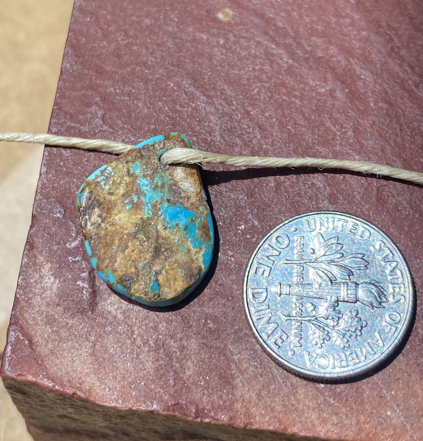 6 carat blue Stone Mountain Turquoise tab style bead with red matrix